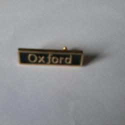 petite broche marquée OXFORD 33 mm X 9 mm