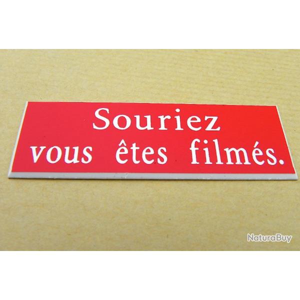 Plaque adhsive pancarte rouge "Souriez vous tes films" Format 50x150 mm