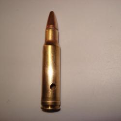 une cartouche de 350 remington neutralisée, amorce percutée, étui percé, ogive demi blindée