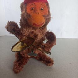 ancien jouet singe batteur de timbales avec sa clé