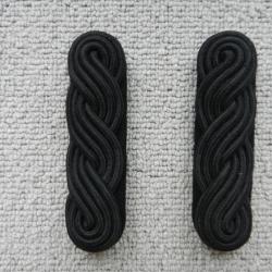 ancienne paire d'épaulettes de couleur noire tressées