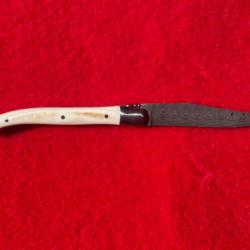 Couteau Laguiole : lame Damas, manche défense de phacochère, fabrication française