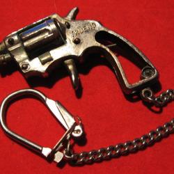 porte clef pistolet metal blanc long 50mmx38mm gachette ,percuteur articulés