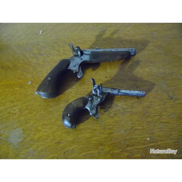 LOT DE 2 PISTOLETS DE CYCLISTE  1 AVEC GARDE MAIN  A RESTAURER + 1 PUPPY DE CYCLISTE