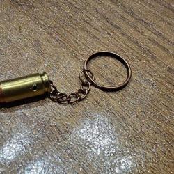 Porte clé véritable balle 9 mm, couleur Cuivre, fait main (Munition désamorcée et neutralisée)