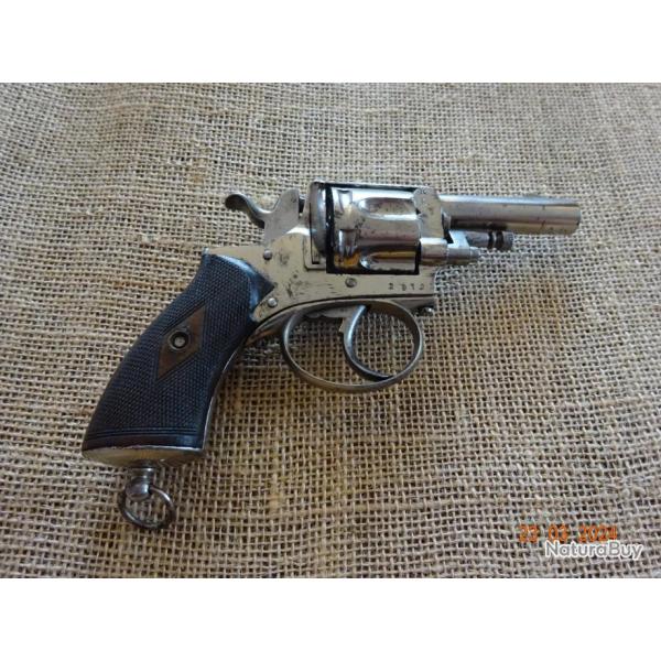 Beau revolver bulldog nickel calibre 320 avec pontet et anneau de calotte.