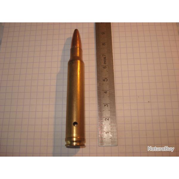 une cartouche de 8mm remington magnum , neutralise, tui perc, amorce percute, ogive demi blinde