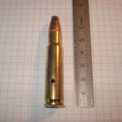 une cartouche de 356 winchester, neutralisée, étui percé, amorce percutée, ogive demi blindée