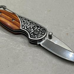 Couteau pliant mousqueton orné enchère