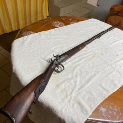 Ancien fusil juxtaposé a broche à rechargement par le canon