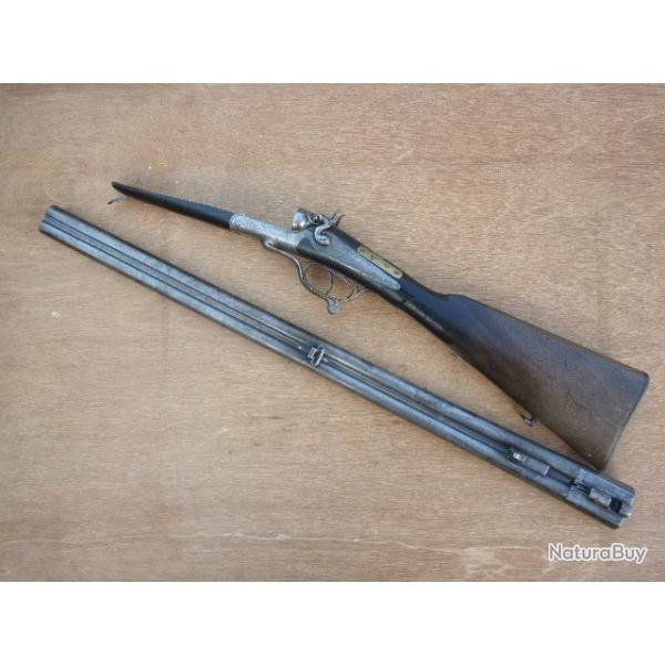 FUSIL DE CHASSE stephanois   JUXTA a CHIENS PERCU CENTRALE POUDRE PYROXYLEE  (crosse cassee);