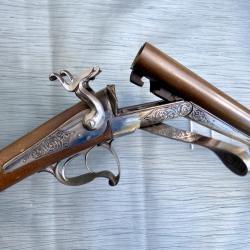 Fusil de chasse à double canon juxtaposé, calibre 20 à broche.
