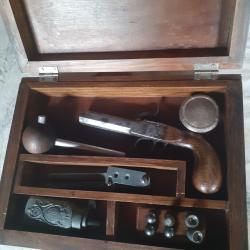 Pistolet à balle forcée de coffre ou de voyage en coffret.