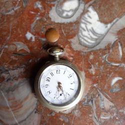 MONTRE A GOUSSET GURZELEN  PAR OMEGA   SWISS .  PARFAIT FONCTIONNEMENT  .