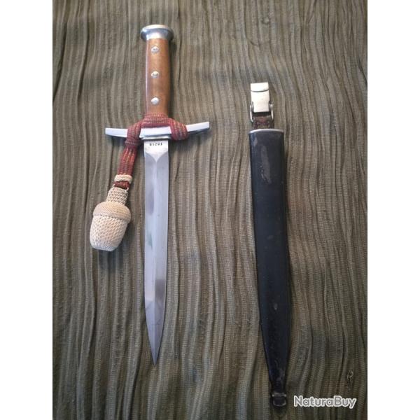 Dague d'Officier de l'Arme suisse Annes 40 Dragonne rouge avec fils d'argent Gland blanc cass.