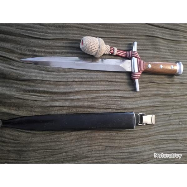 Dague d'Officier de l'Arme suisse Annes 70 Dragonne rouge avec fils de coton Gland blanc cass.
