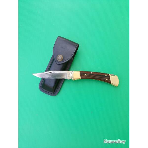 COUTEAU :  BUCK  110  AVEC SON FOURREAU CUIR  .