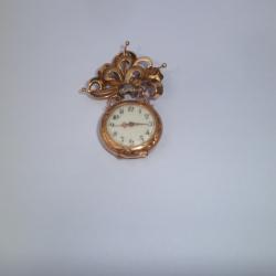 MONTRE ET BROCHE EN OR