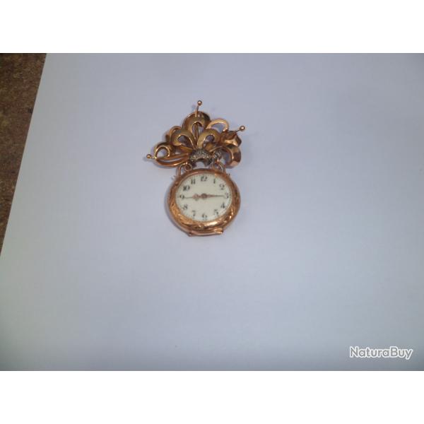 MONTRE ET BROCHE EN OR
