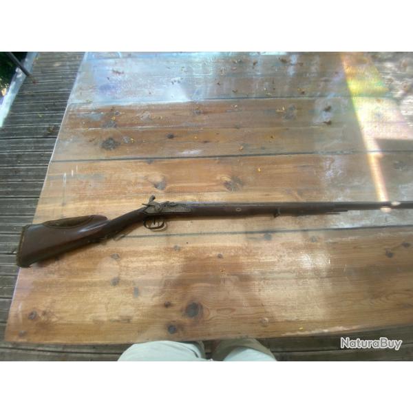 Vieux fusil de chase dans son jus