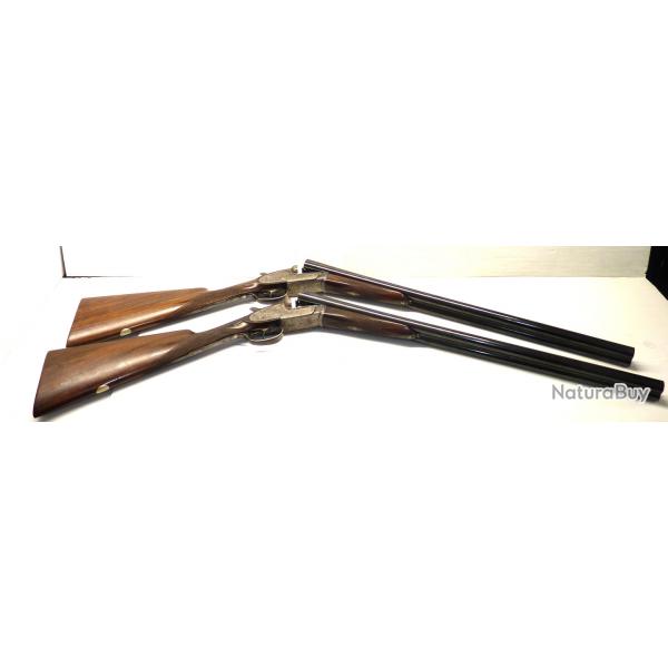 PAIRE DE JUXTAPOSES A PLATINES AYA- CAL 12/70- CANONS DE 63CM- UN MODELE SOUS BOIS L'AUTRE PLAINE