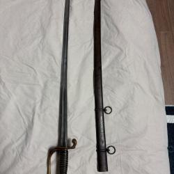 Sabre d'adjudant modèle 1855/82, garde en laiton ajourée; lame à dos signée