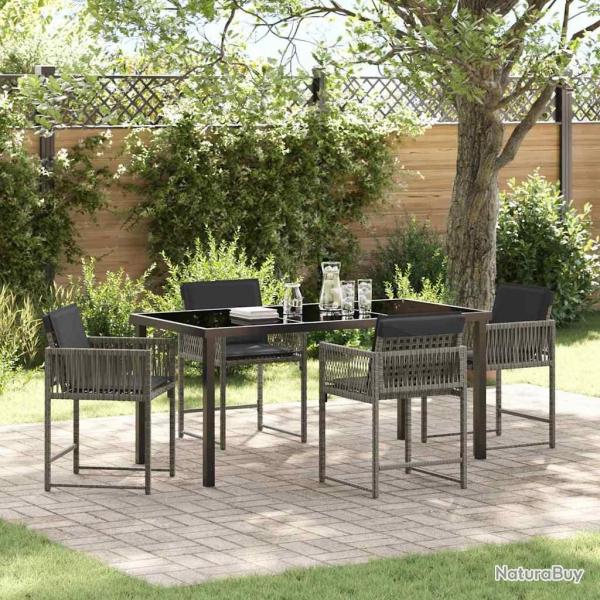 Ensemble de salle  manger de jardin 5 pices avec des coussins en rattan synthtique gris.