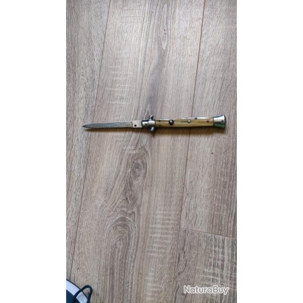Couteau  systme italien manche corne