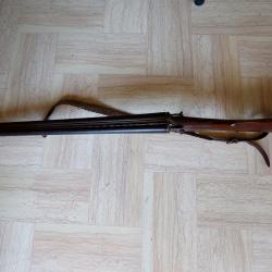 fusil lefourcheux juxtaposé à Chiens
