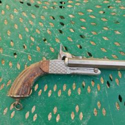 Pistolet à broche deux canons