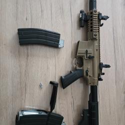 "Bushmaster" parfait état.  Utilise des billes acier . Complet option chargeur gde capacité.