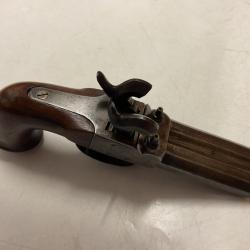Pistolet à percussion deux canons.
