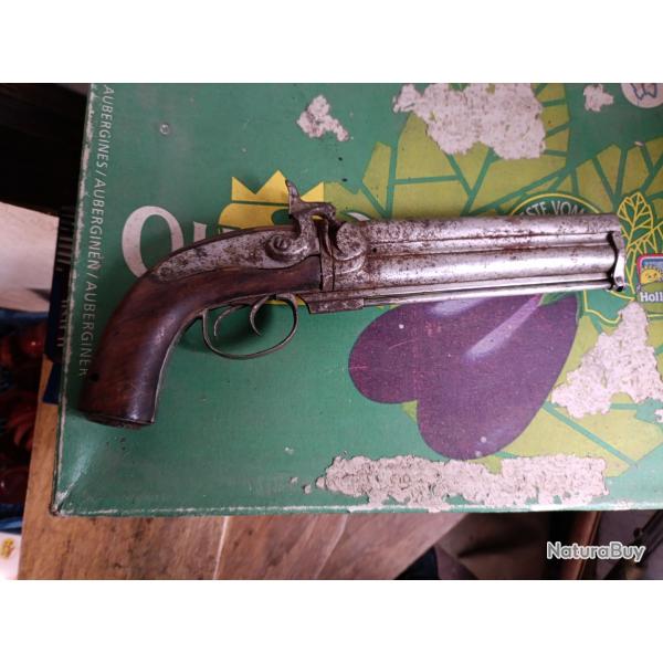 Pistolet a percussion canons superposs