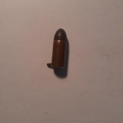 1 petite ancienne  cartouche a broche 7 mm