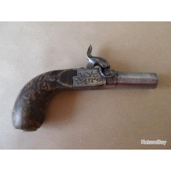 Pistolet de poche a percussion et a coffre