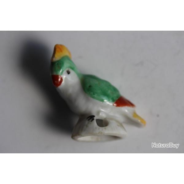 Pare gouttes porcelaine pour thire Oiseau perroquet th