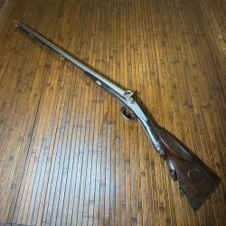 FUSIL JUXTAPOSÉS A PERCUSSION PLATINE SIGNÉE ET CROSSE EN BOIS SCULPTÉ