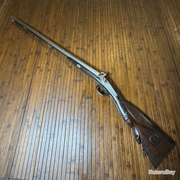 FUSIL JUXTAPOSÉS A PERCUSSION PLATINE SIGNÉE ET CROSSE EN BOIS SCULPTÉ