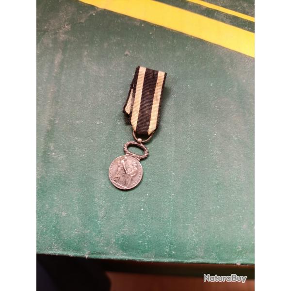 Rduction de mdaille socit de secours mutuels