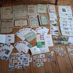 Lot actions, billets, enveloppes 1er jour, timbres, monnaies, cartes postales,..