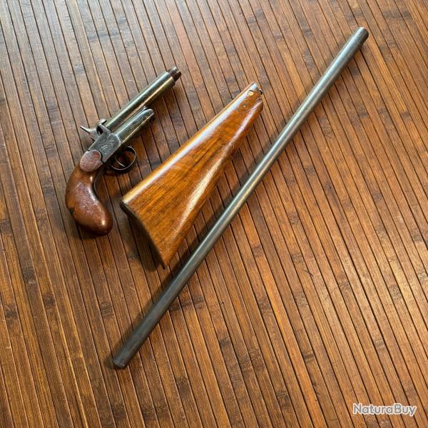 PISTOLET CARBINE DE BRACONNIER DMONTABLE EN TROIS PARTIES CANON BASCULANT CALIBRE 20